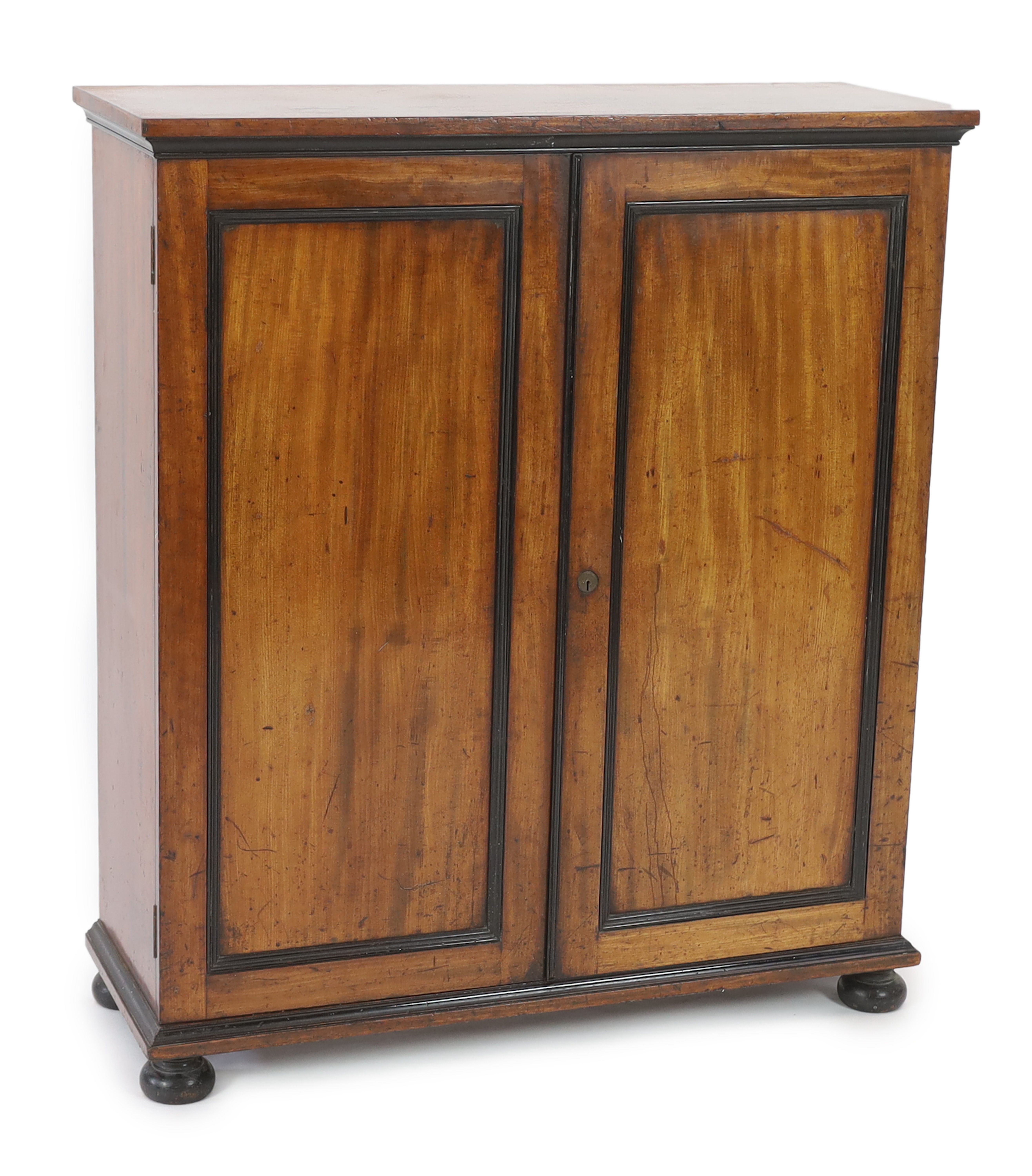 An unusual William IV ebony and mahogany cigar cabinet